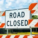 Road Closed sign and barricades on a street