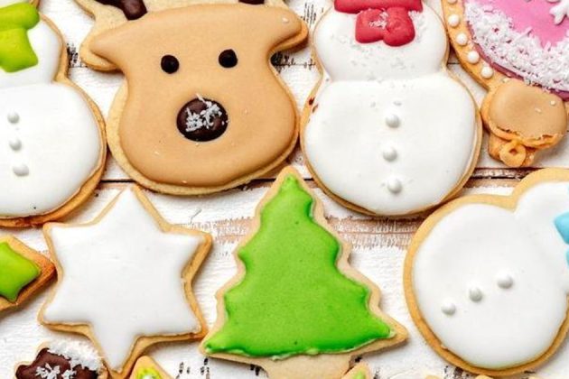 holiday cookies decorated with icing and sprinkles