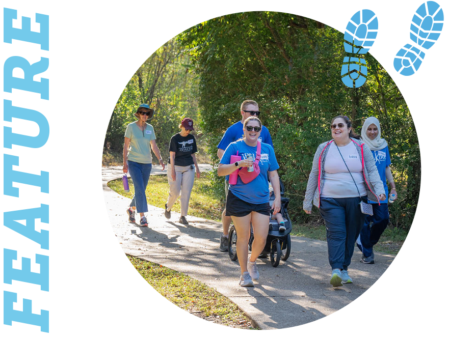 Event feature: group of people walking down a park path