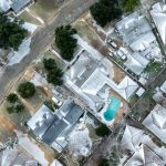 aerial photo of a Bryan neighborhood with roofs covered in snow and ice