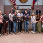 Development Services and Planning employees group photo showcasing the award trophy