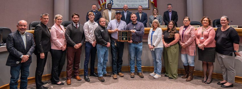 Development Services and Planning employees group photo showcasing the award trophy