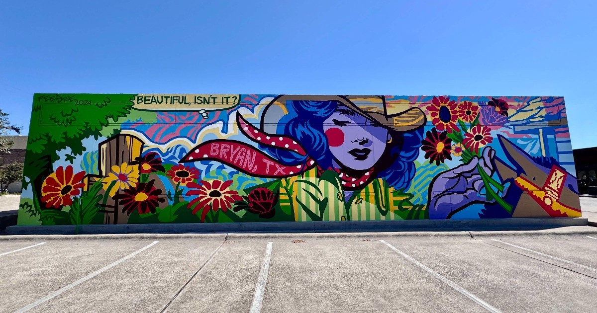 colorful mural on the side of a building featuring a cowgirl holding flowers in a pop art style