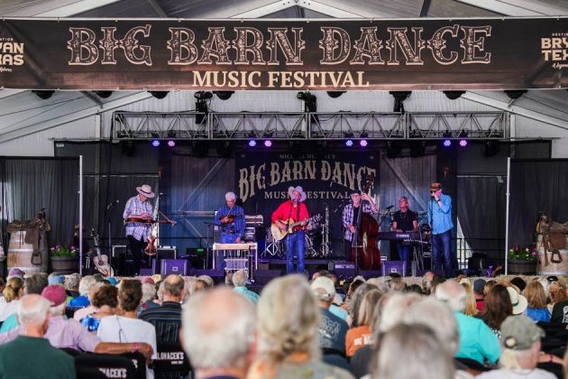 band performing on a stage with a crowd of people at the Big Barn Dance Music Festival