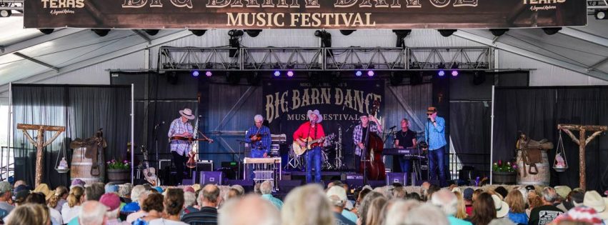 band performing on a stage with a crowd of people at the Big Barn Dance Music Festival